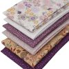 Fat quarters featuring leaves and foliage's in cream beige and mauve.